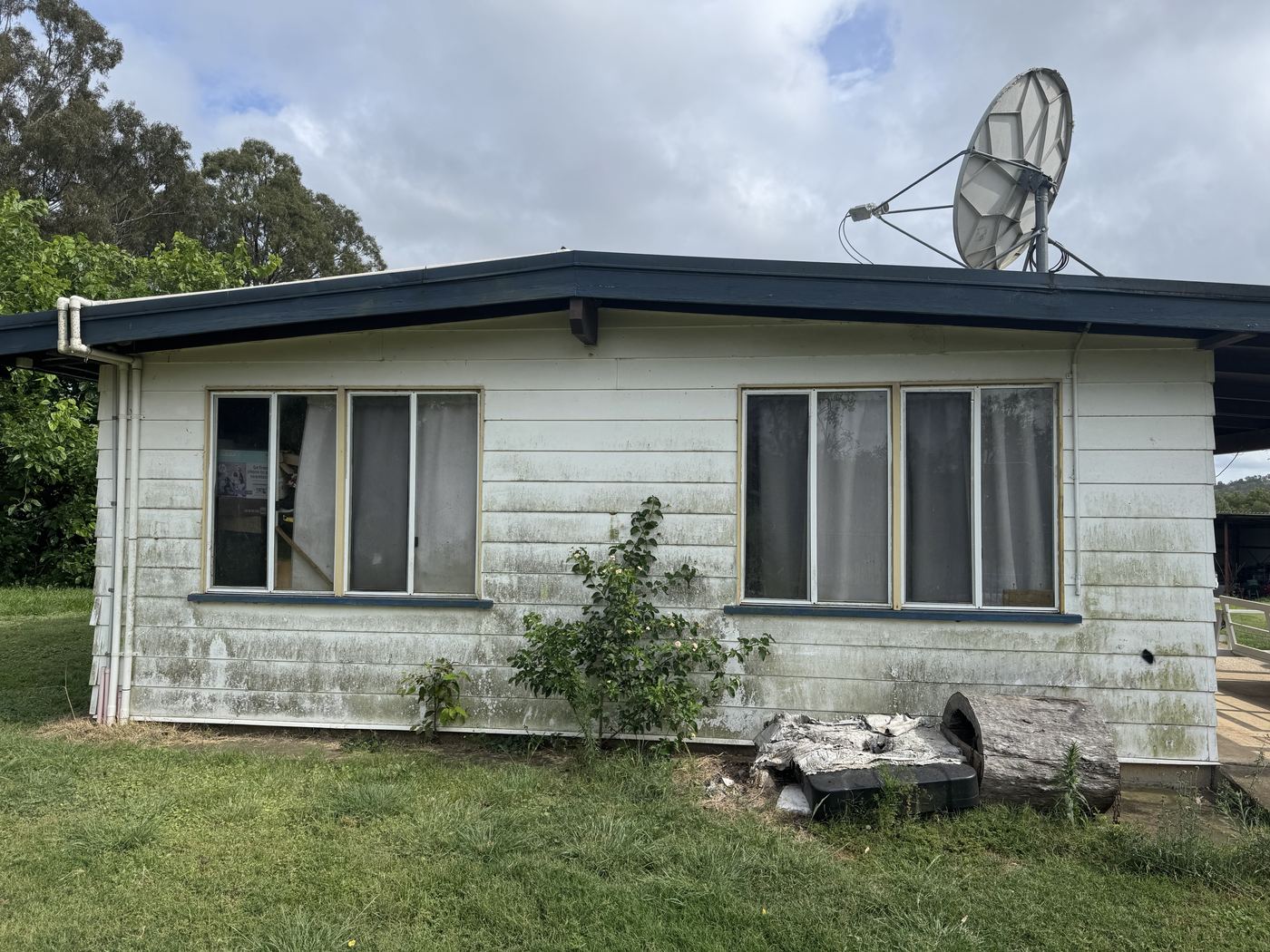 After — Rural weatherboard home bright white after house washing
