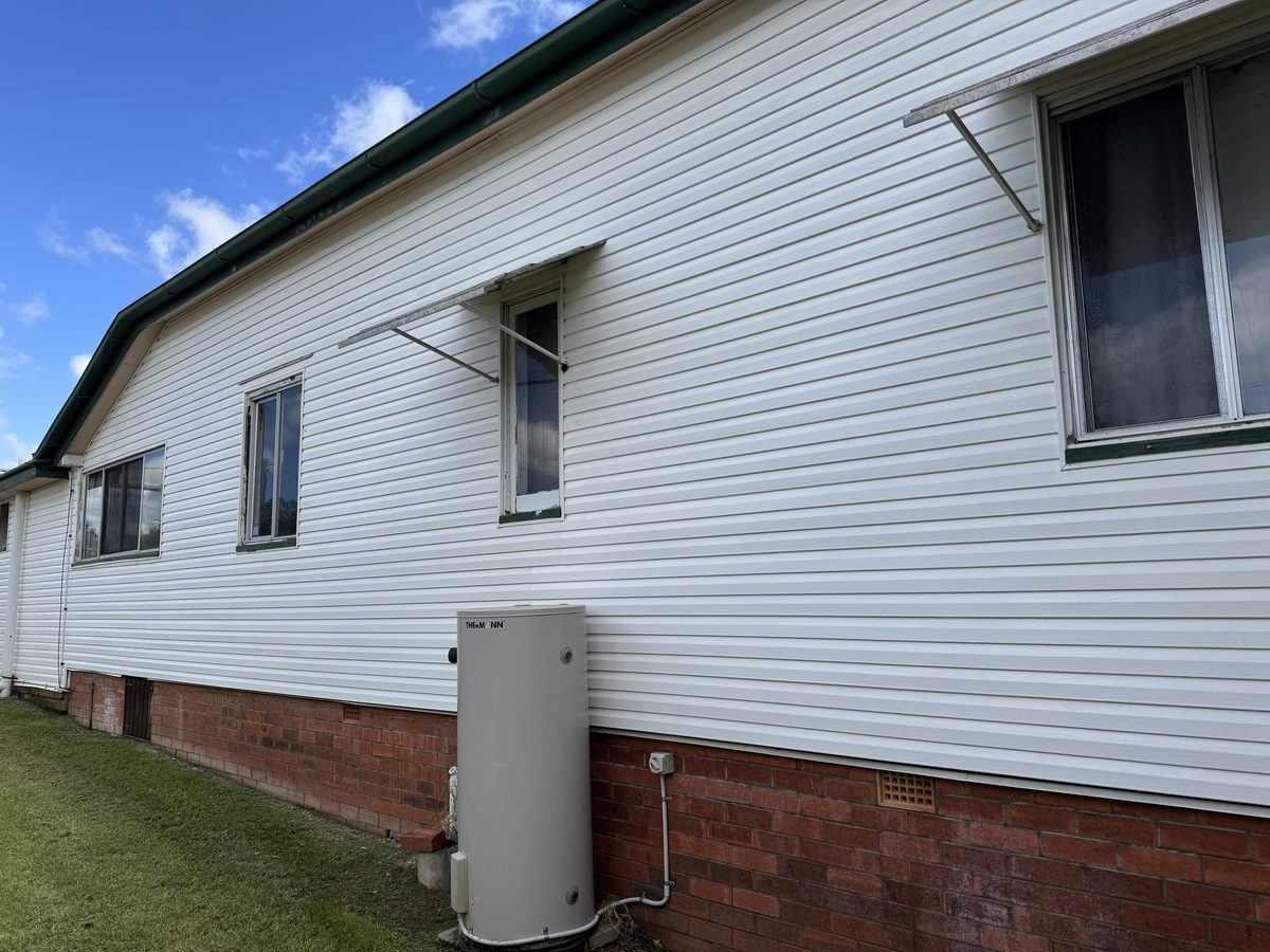House exterior after soft wash cleaning — spotless, bright result